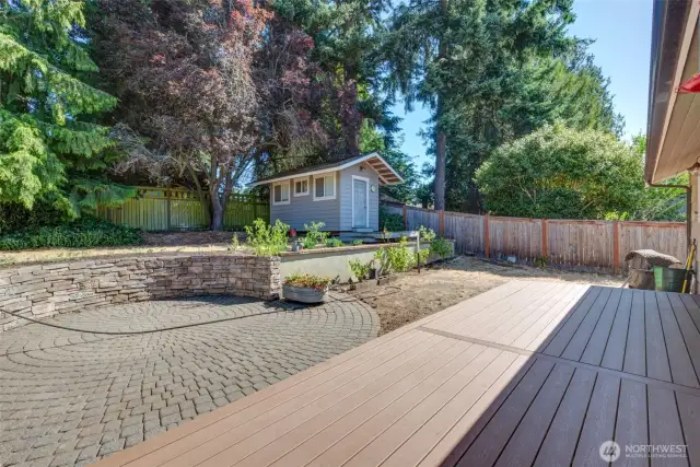 Composite deck and nice brick work in the back yard.  Also a large shed.