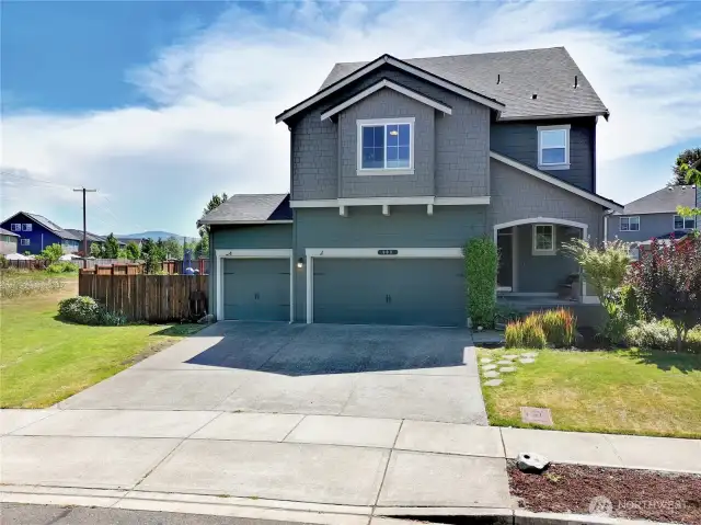 Welcome home to mountain views! Perched perfectly at the end of a quiet street, this stunning Craftsman not only offers incredible curb appeal but also peekaboo views of Mt. Rainier right from your driveway.