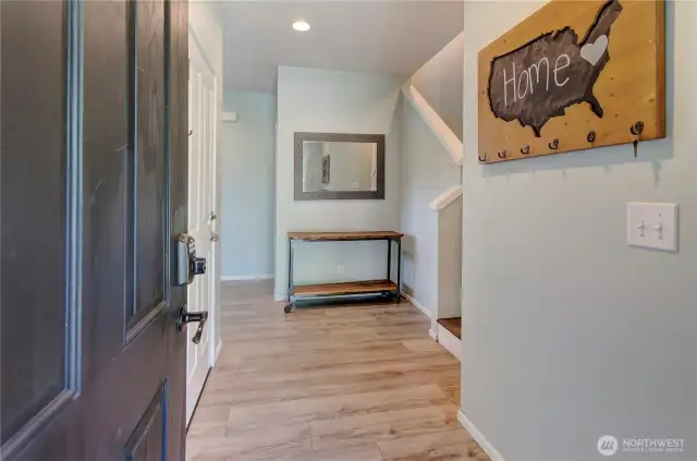 Step inside and feel right at home—this welcoming entryway features updated flooring, warm accents, and a layout that instantly invites you in.