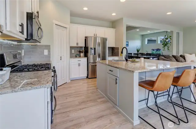 Open, airy, and designed for connection—this kitchen flows effortlessly into the dining and living areas, making it the heart of the home for meals, gatherings, and everyday living.