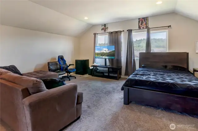 Located on the third floor, this oversized bonus room doubles as a fifth bedroom or flex space—perfect for guests, a media room, home office, or teen retreat with scenic views.