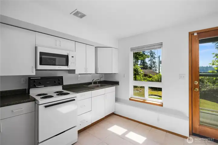 Kitchenette with ample storage.