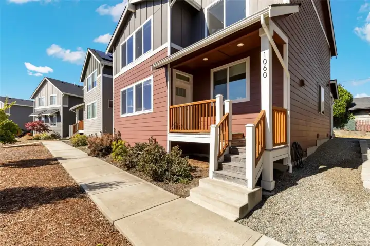 Stroll the landscaped path to your covered front porch.