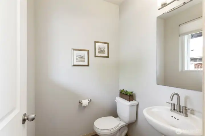 Stylish half bath with simple, modern finishes.