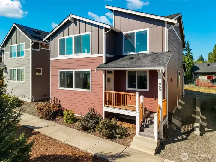 Welcoming exterior with porch and low-maintenance yard.