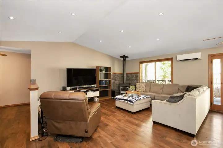A look inside from the front entry. Great open floor plan! Perfect for entertaining! Nice wood stove for those chilly evenings and a mini split for both heat and A/C!