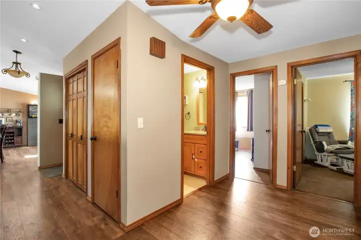 A look from the hallway. Guest bath and 2 bedrooms. Primary suite behind us