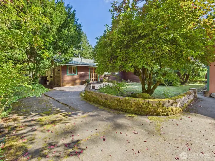 Mature landscaping surrounds property.