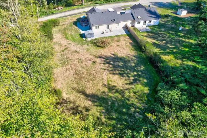 Aeiral view of the back of home and yard