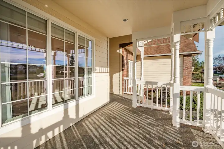 Covered Front porch facing South for lots of sun.