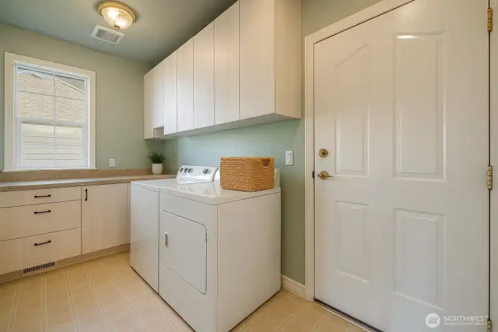 Virtually Staged Laundry Room, really neat cabinets with corner pull outs.