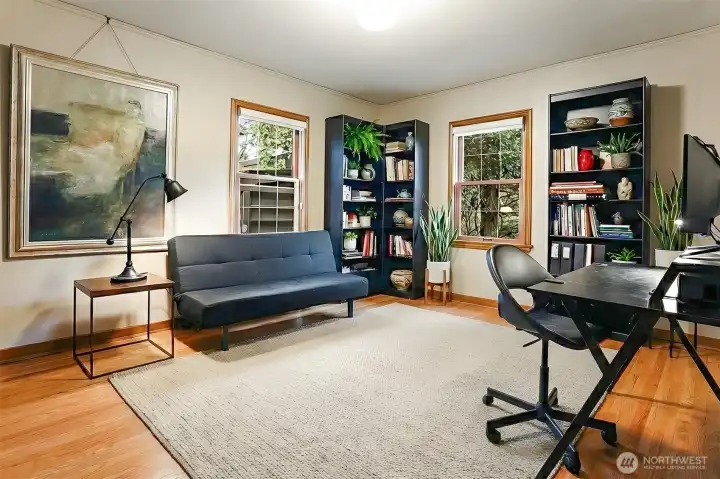 The main floor office or bedroom.  The whole house has beautiful oak flooring.