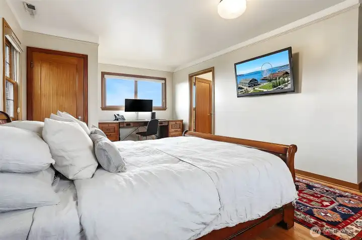 Primary with door to one of two closets and to the primary bath.
