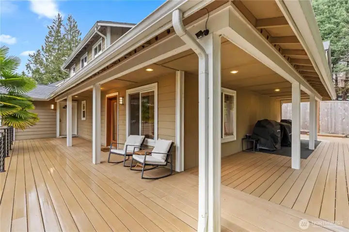 New lifetime deck surface with custom-made railings, providing a durable and inviting outdoor space to relax and take in the scenic surroundings.