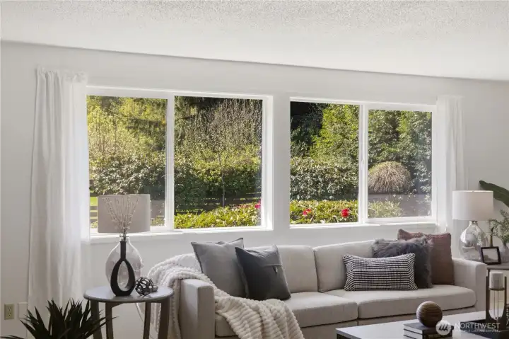 Through the windows of the living room, enjoy scenic views of the greenery in the backyard. Peaceful and private!