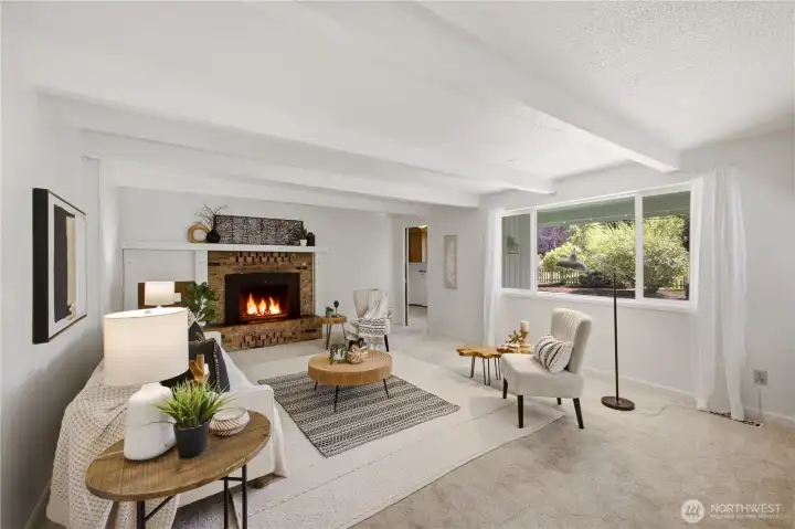 Adjacent to the kitchen is this cozy family room. It's a perfect space to unwind or enjoy a favorite show.