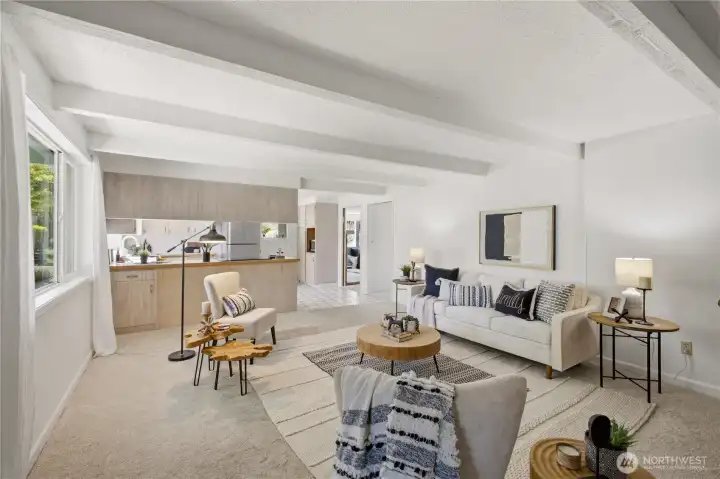 Another view of the family room, kitchen, and doors to the dining room and living room.