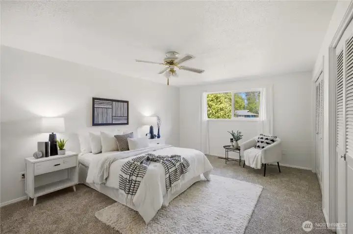 Tucked into the quiet front corner of the home is this spacious primary bedroom. You'll find brand new carpet in all 4 bedrooms.