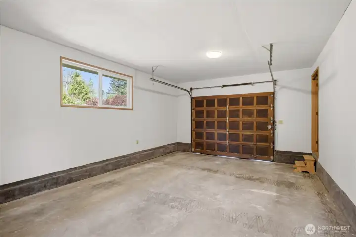 The attached garage is fully finished, and provides ample space for vehicles, tools, garden supplies, or your kayak.