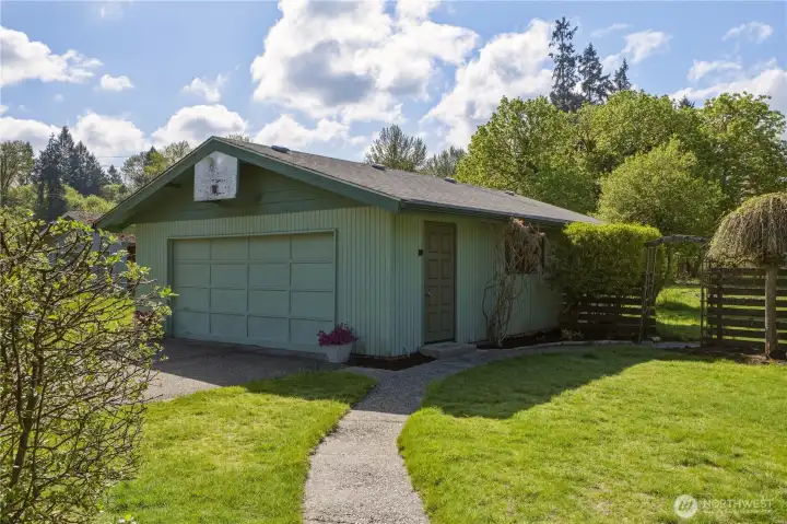 A paved walkway from the home leads to the detached, 768 sq ft garage. Ideal for hobbies, vintage car restoration, or a studio space!