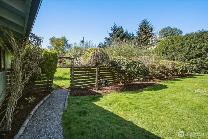 Follow this path to the back pasture of the property, with additional space for pets, gardens, fruit trees, and more.