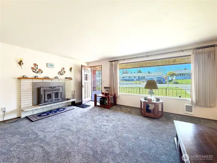 Large living room with large picture window.