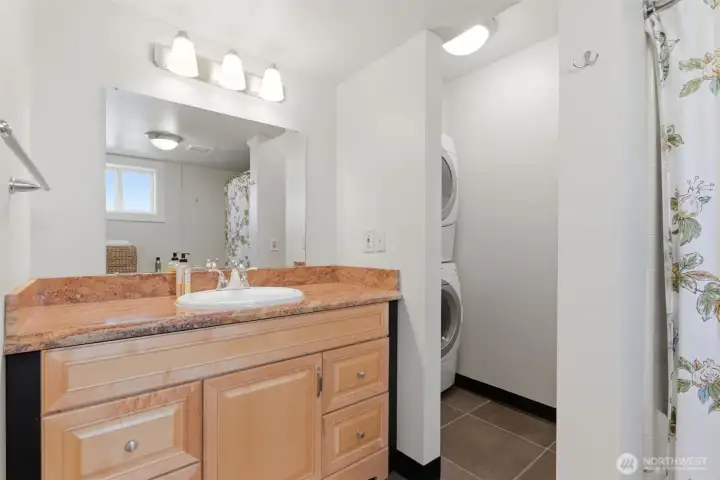 Lower level includes additional laundry.