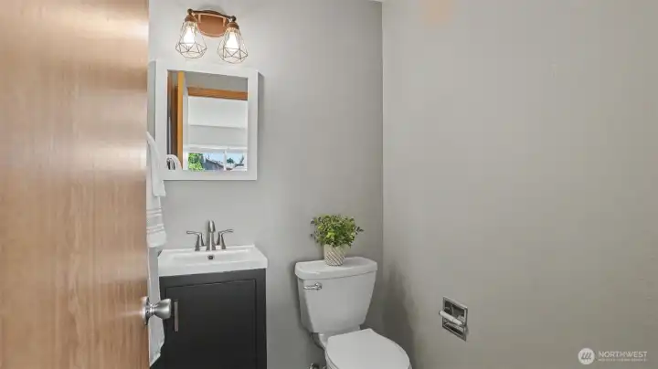 Convenient main-level powder room with updated fixtures and modern finishes