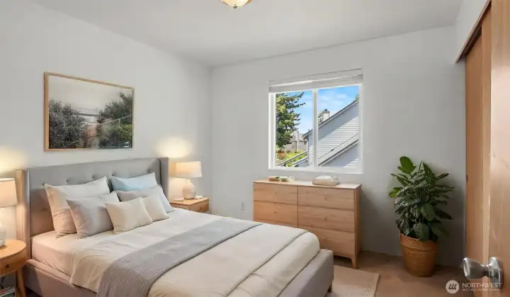 Virtually Staged North-facing fourth bedroom offers flexible use as office, craft room, or guest space with soft natural light throughout the day