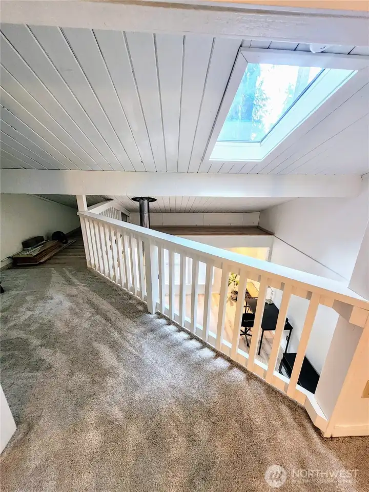 Closet and extra storage area in loft.