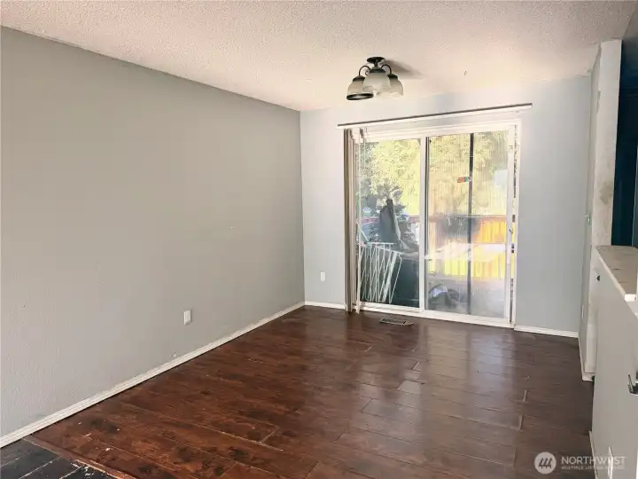 Dining room with sliders to large back deck, creating the perfect indoor/outdoor entertaining space!
