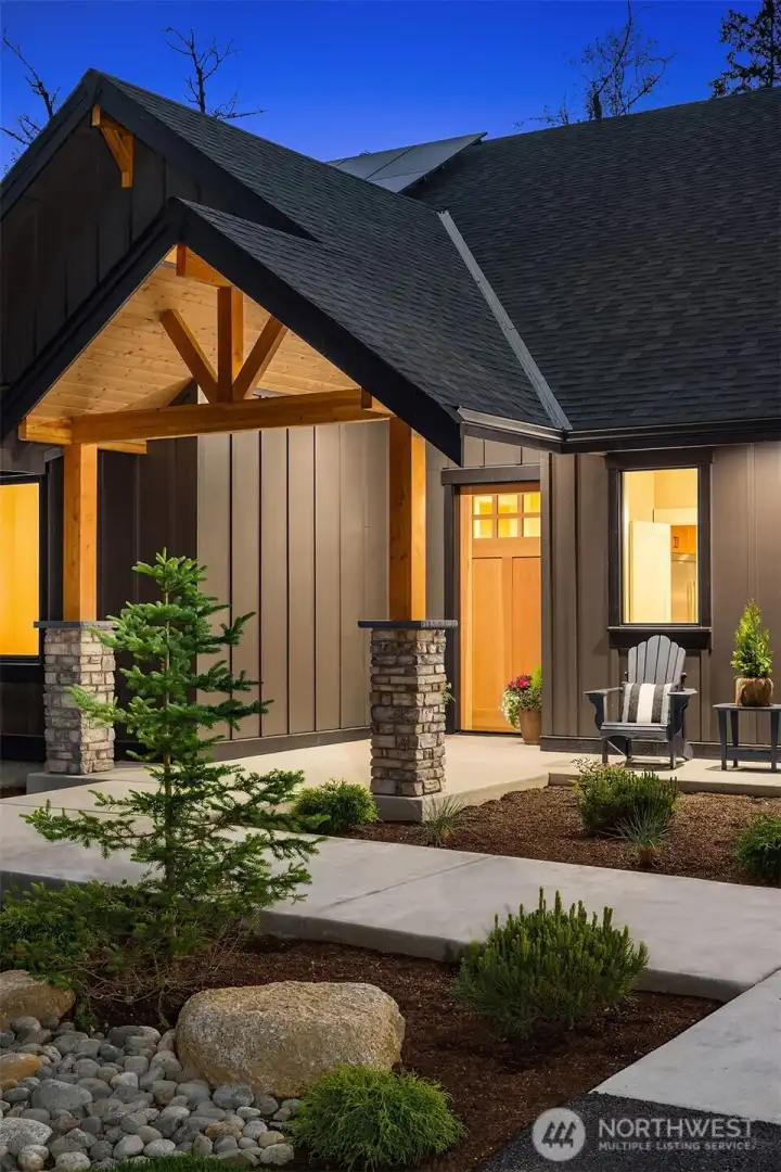 Covered front porch creates a warm and welcoming entry.