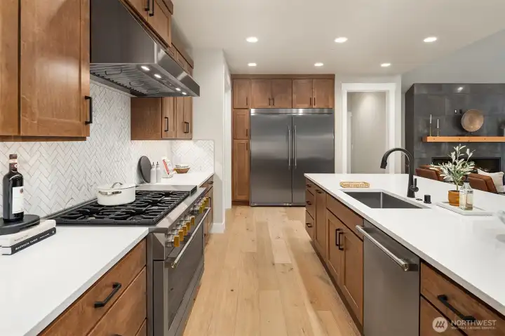 The kitchen features soft-close drawers and convenient pull-out shelves.