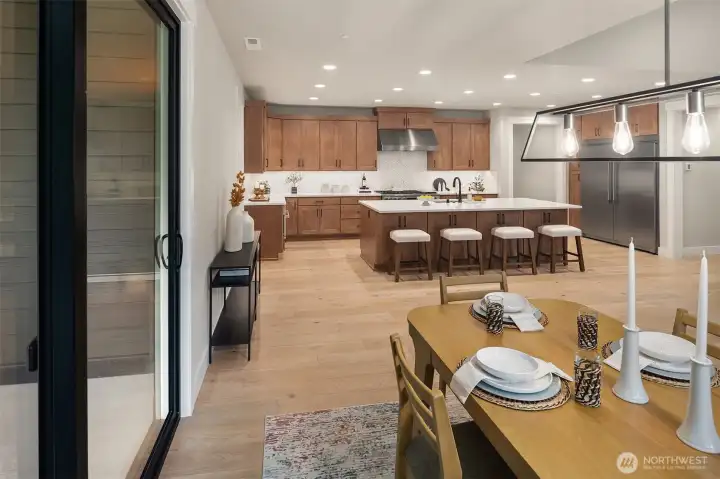 Expansive outdoor living area seamlessly connected to the dining room and kitchen.
