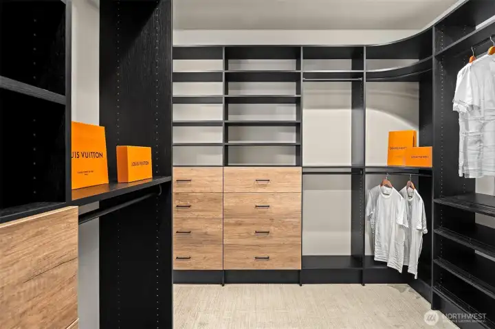 Custom-designed primary closet with a tailored organization system.