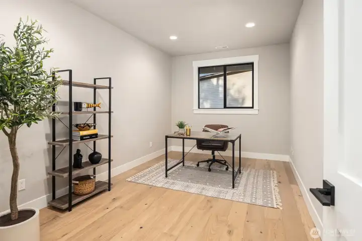 Main-level office offers flexible space and can easily function as a home gym.