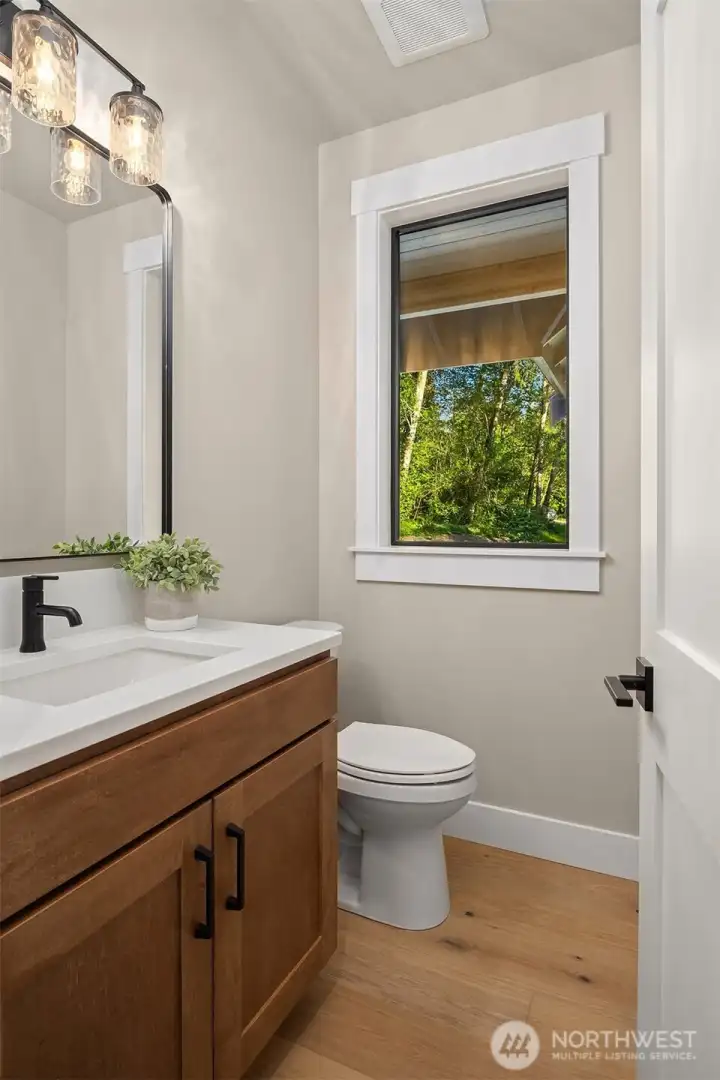 Stylish main-level guest powder room.