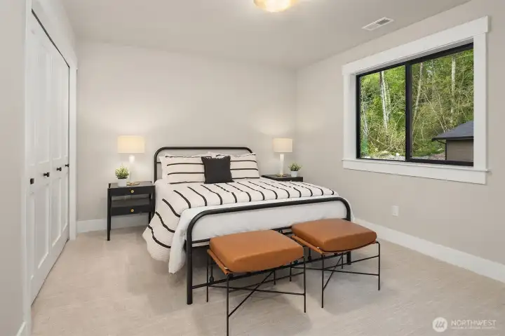 Upper-level 4th bedroom offers privacy and functions perfectly as a guest suite.