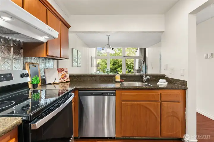 Kitchen looks out onto dining and living areas. Kitchen looks out onto dining and living areas.
