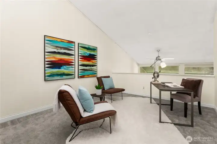 The second bedroom staged as an office has an airy loft feel. The second bedroom staged as an office has an airy loft feel.
