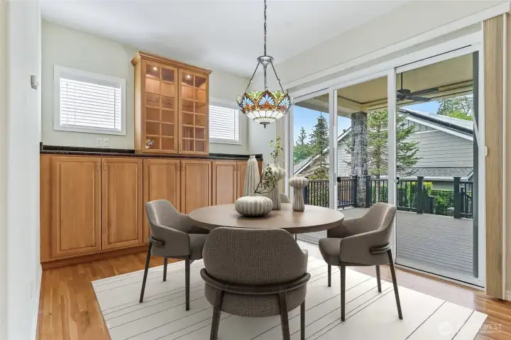 Informal eating area with a built-in, lighted display cabinet. Virtually staged.