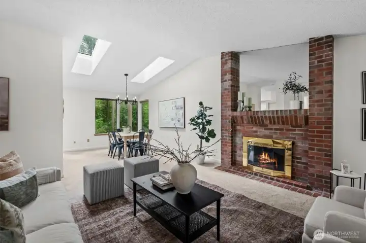 Living room centered around wood burning fireplace