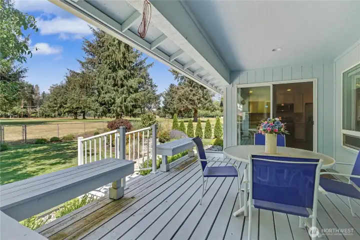 View of your deck and back yard, WOW. Deck is new, and you look over the 4th fairway, just a beautiful, relaxing space.