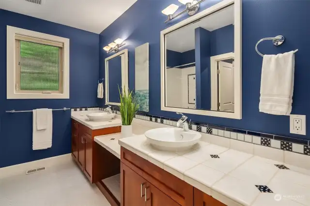 Large bathroom with two sinks, dressing area plus counter space.