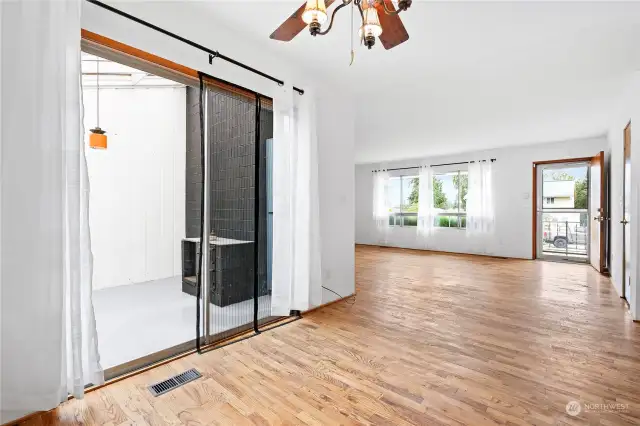 This photo captures the view from the dining room into the living room.