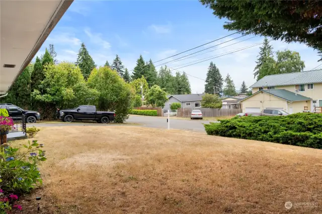 Summertime and the grass is dry but we know in a few months the PNW rain will turn it green in no time. The long driveway allows for additional parking.