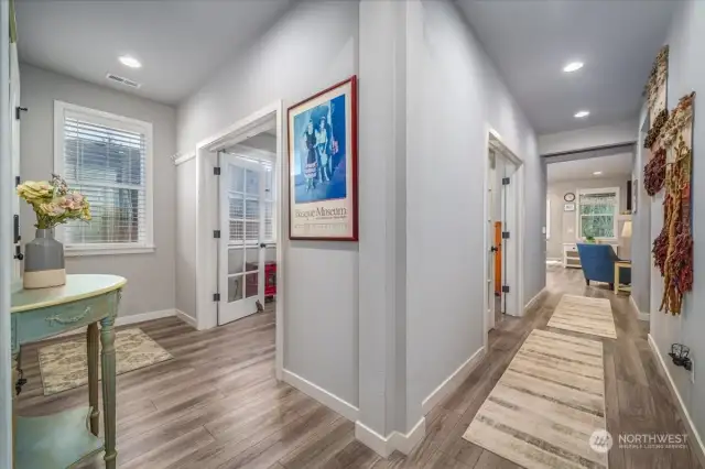 Entry on the left and hallway to the kitchen and living room on the right.