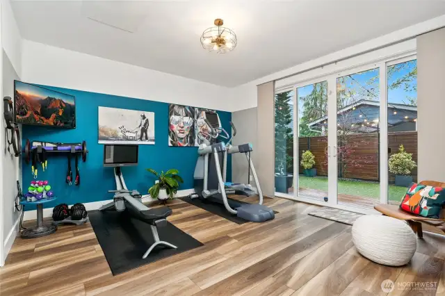 Multi-purpose room on the first floor with 3/4 bathroom. French doors to the back deck.