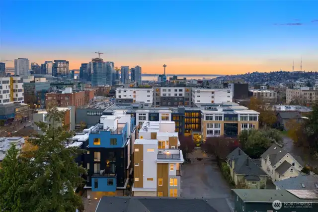 This aerial view showcases your proximity to the vibrant Seattle skyline, the Space Needle, and the beauty of Puget Sound—a prime location for the ultimate urban lifestyle.