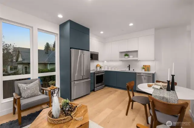 The heart of the home, this sleek kitchen features stainless steel appliances, designer cabinetry, and gorgeous views.